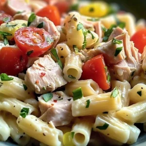 Delicious tuna pasta salad served in a bowl, ready for a refreshing meal.
