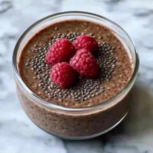 Delicious chocolate chia pudding topped with fresh berries and nuts.