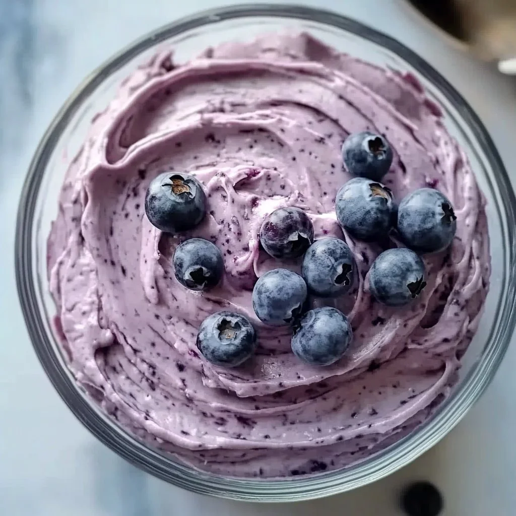 Delicious blueberry cream cheese frosting on a baked dessert