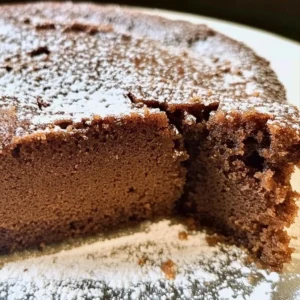 Slice of Farmhouse Ginger Spice Cake topped with icing and spices