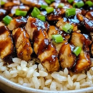 Delicious Honey BBQ Chicken served over rice with vibrant garnishes